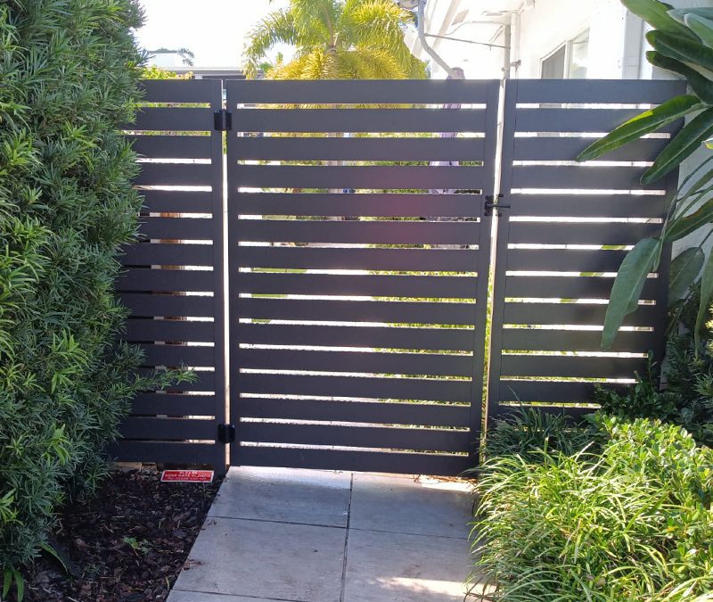 Ft. Lauderdale, FL – Replace Wood Shadowbox with 6′ Custom Bronze Horizontal Fence & Gates (After)