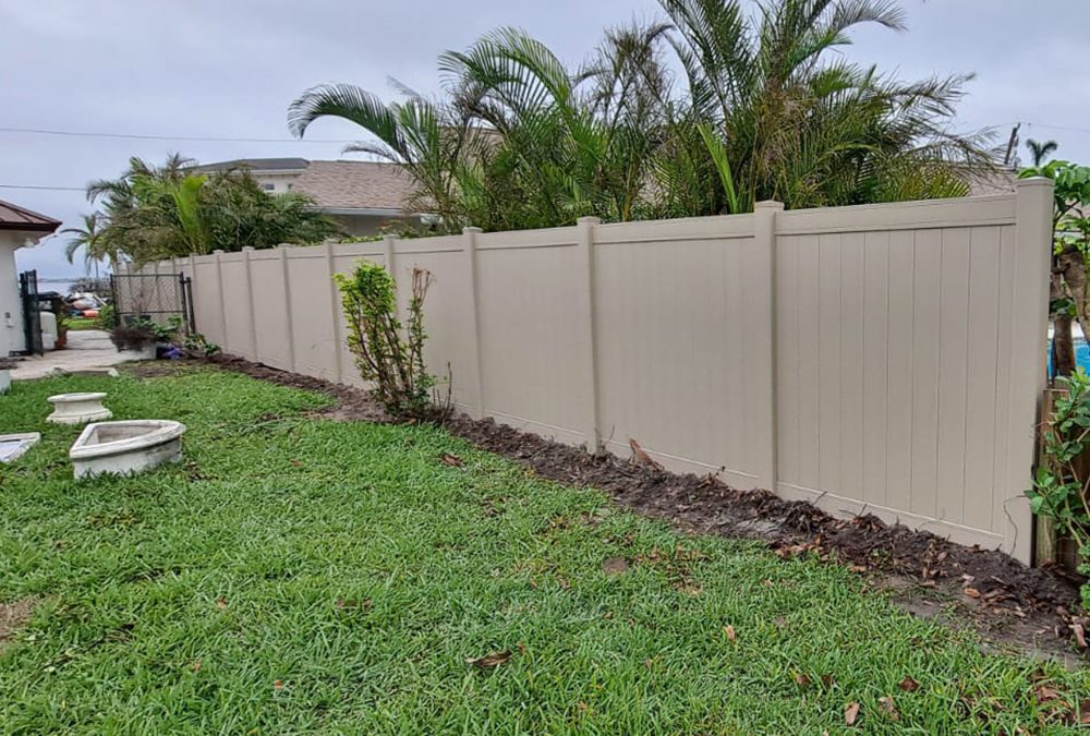 Cape Coral, FL – Hurricane Damaged Wood Fence Replaced with New Khaki PVC Privacy Fence