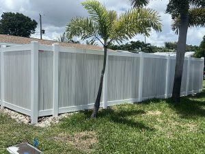 6' Vertical White Frame PVC Privacy Fence with Weathered Aspen Pickets in Fort Lauderdale