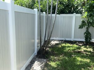 6' Vertical White Frame PVC Privacy Fence with Weathered Aspen Pickets in Fort Lauderdale